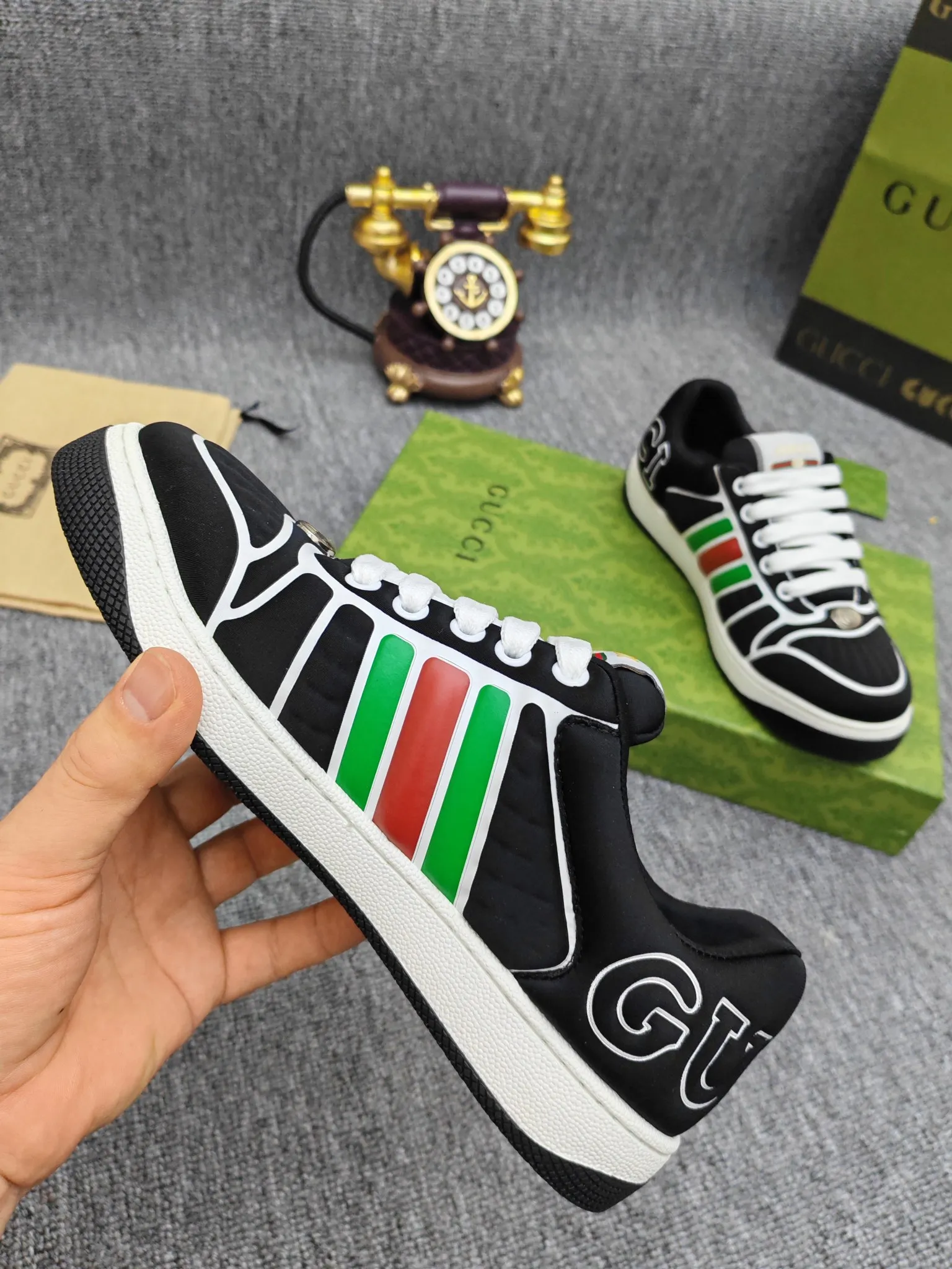 Factory price 600💰Screener series embellished web sneakers. This item is from the Gucci Lido series. Its design is inspired by the summer style and beach clubs of the Italian coast. The Screener series of sneakers draws inspiration from classic sneakers from the 1970s and takes its name from a special defensive move in sports. This shoe from the 2024 Pre-Fall collection is crafted from yellow rubber, a technical and malleable opaque material, with striped webbing on the sides and an embossed Gucci printed logo on the heel. Yellow rubber, opaque and technological in appearance. Red and green webbing decorated with metal Double G oval enamel details. Gucci printed embossed logo. Women 35-40, men 38-45, (men 38 and 45 need to be customized)